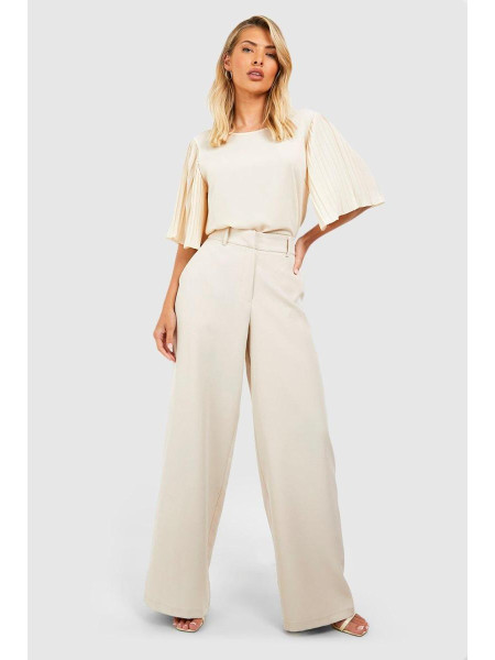 Кремова плетена блуза зі складками