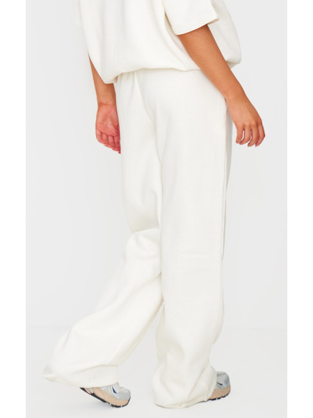 Бігові штани PRETTYLITTLETHING кремового кольору з широкими штанинами середньої посадки