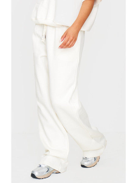 Бігові штани PRETTYLITTLETHING кремового кольору з широкими штанинами середньої посадки