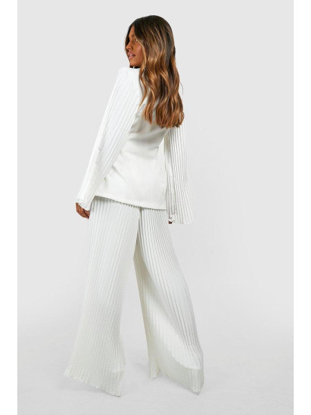 Штани з широкими штанинами в складку