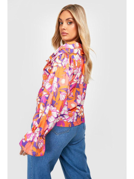 Помаранчева блузка з квітковими рюшами