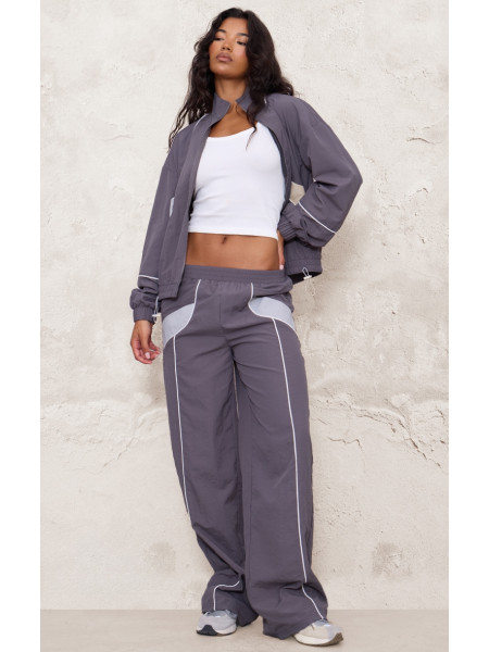 Широкі джоггери на блискавці темно-коричневого кольору з контрастною палітуркою