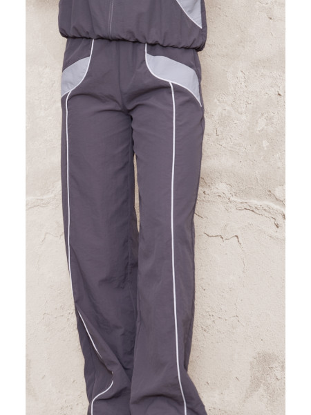 Широкі джоггери на блискавці темно-коричневого кольору з контрастною палітуркою